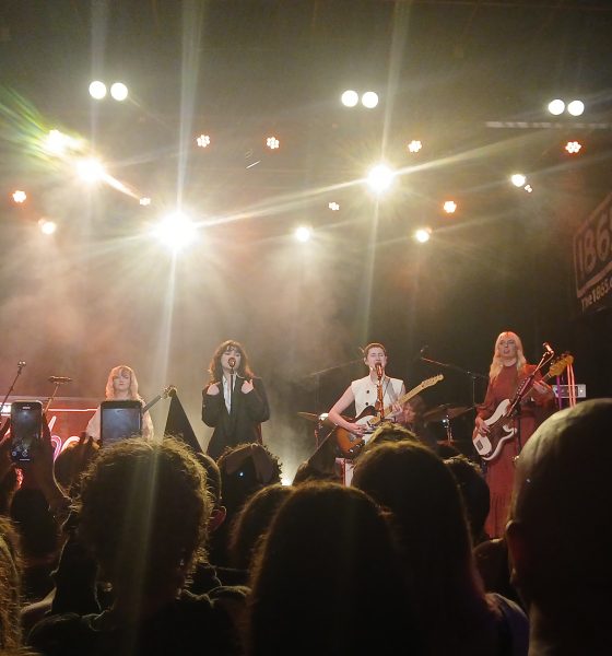 Photo taken by Meadbh Corbett. Aurora Nishevci, Emily Roberts, Abigail Morris, Lizzie Mayland and Georgia Davies on stage performing their song 'Agnus Dei'