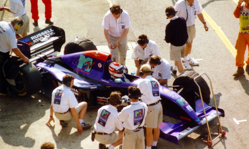 This is an image of Roland Ratzenberger within his car, courtesy of Sgozzi - Own work