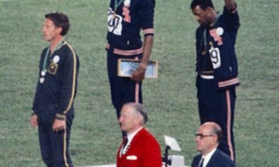 This image shows both John Carlos and Tommie Smith lifting their fists in support of black lives courtesy of Angelo Cozzi (Mondadori Publishers)
