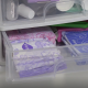 A clear plastic drawer full of period pads