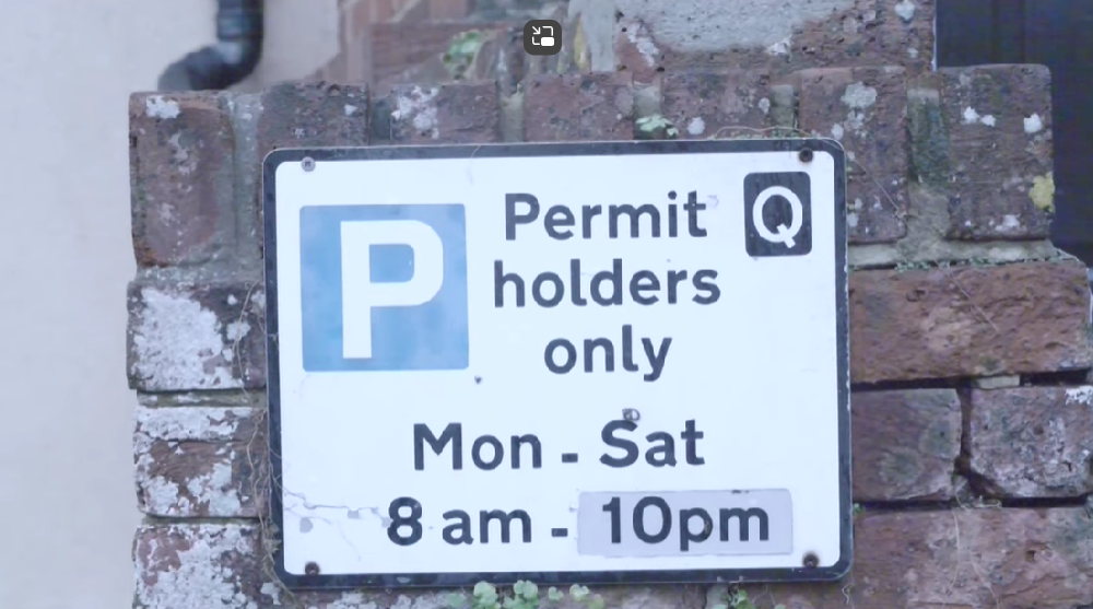 Permit sign. Text says: "Permit holders only Mon-Sat 8am-10pm"