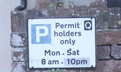 Permit sign. Text says: "Permit holders only Mon-Sat 8am-10pm"