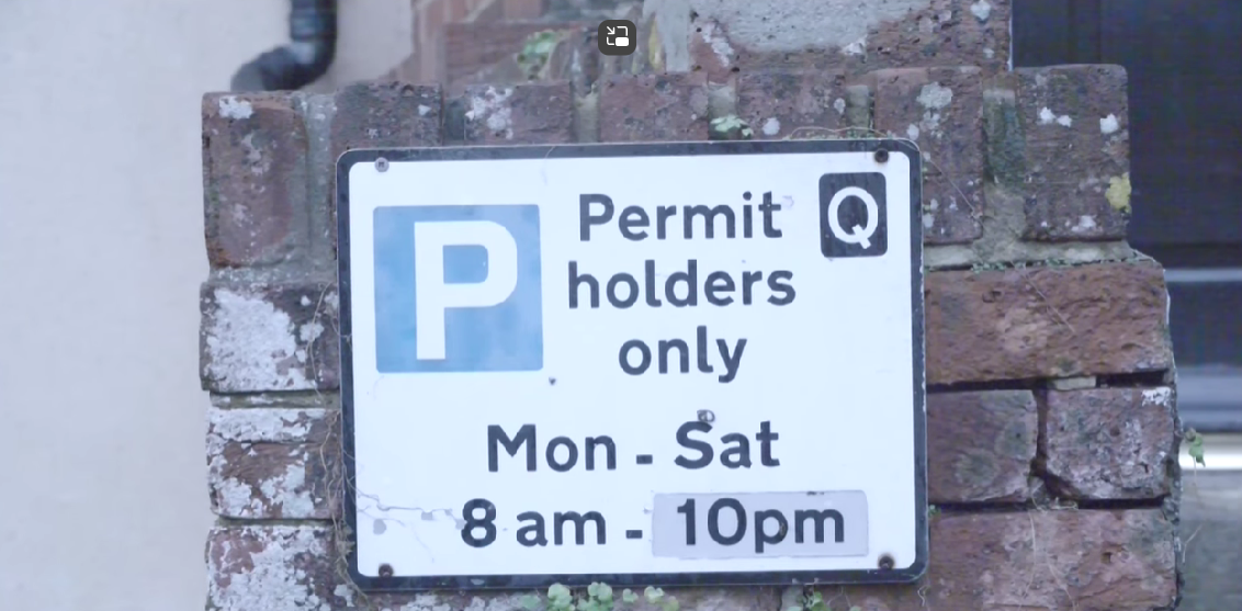 Permit sign. Text says: "Permit holders only Mon-Sat 8am-10pm"